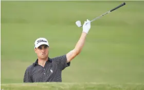  ?? Sam Greenwood / Getty Images ?? Justin Thomas shot his second straight 5-under-par 65 Sunday at the Sony Open in Honolulu — a ho-hum finish after carding 59-64 Thursday-Friday.