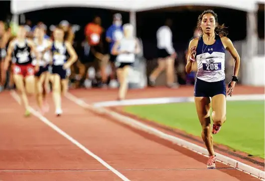  ?? Photos by Marvin Pfeiffer / Staff photograph­er ?? Boerne Champion's Anastacia Gonzales pulls away from the field as she runs toward the finish line to win the Class 5A 1,600-meter run in 4:49.11.