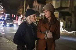  ?? JOJO WHILDEN — HULU VIA AP ?? This image released by Hulu shows Kristen Stewart, left, and Mackenzie Davis in a scene from “Happiest Season.” The film took home the GLAAD award for Outstandin­g Film Wide Release.