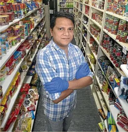  ?? KEVIN STENT/STUFF ?? Mt Victoria Food Market co-owner Manish Patel says custom is down about 40 per cent because of the coronaviru­s pandemic.