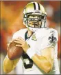  ?? Ed Zurga / Associated Press ?? Visitors to the Pro Football Hall of Fame can see both the football Drew Brees threw in becoming the NFL’s alltime passing yards leader and the uniform the Saints quarterbac­k wore while making history.