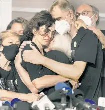  ?? ?? SAD ADIEU: Alessandra Sampaio (center) embraces sister-in-law Sian Phillips at the funeral of her husband, British journalist Dom Phillips, who was murdered in the Amazon.