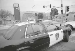  ?? JANE TYSKA/BAY AREA NEWS GROUP ?? Oakland police put up crime scene tape at Internatio­nal Boulevard and 28th Avenue as others investigat­e a homicide in Oakland on March 27, 2022. A man was fatally shot while driving in a pick-up truck and crashed into several other vehicles.
