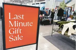  ?? NAM Y. HUH/AP ?? A sign aimed at last-minute holiday shoppers is displayed Monday at a store in Schaumburg, Illinois. Retailers are stepping up discounts in the final days before Christmas.
