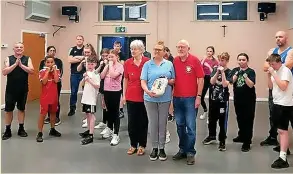  ?? ?? ● Back O’th Moss Community Centre was presented with a heart defibrilla­tor by Rochdale Heartbeat
