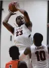  ?? STEVE JOHNSTON/DAILY SOUTHTOWN ?? Leo’s DaChaun Anderson (23) had 18 points, 15 rebounds, four assists and three steals against Bogan on Friday.