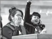  ?? Arkansas Democrat-Gazette/THOMAS METTHE ?? DACA dreamer Diana Pacheco (left) wipes away a tear during her speech as Anika Whitfield (right) cheers her on during the 8th Annual Rally for Reproducti­ve Justice on Saturday at the Arkansas State Capitol in Little Rock.