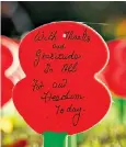  ??  ?? Poppy at the Menin Gate Memorial in Ypres, Belgium, honours WWI soldiers