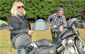  ?? Photos: JOHN HAWKINS/ STUFF ?? Local bikers Jo Harrison-Smith and Kerry Popham from Invercargi­ll setting up camp for a good weekend at the Burt Munro Challenge camp site.