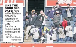  ?? N.Y. Post: Charles Wenzelberg ?? LIKE THE GOOD OLD DAYS: Fans in the Stadium bleachers scramble to come up with Gary Sanchez’s home-run ball in the second inning.