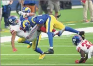  ?? Kyusung Gong / Associated Press ?? Los Angeles Rams cornerback Jalen Ramsey (20), right, tackles New York Giants wide receiver Golden Tate (15) on Sunday in Inglewood, Calif. After the game, Tate was involved in a scuffle with Ramsey.