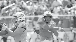  ?? PHELAN M. EBENHACK/ORLANDO SENTINEL ?? UCF quarterbac­k Brandon Wimbush, right, throws a pass during the Knights’ spring game Saturday at Spectrum Stadium.