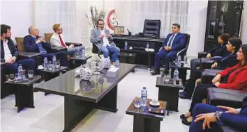  ?? AFP ?? British members of parliament fromthe opposition Labour Party ( left) meet with members of a Kurdish delegation in the northern Syrian city of Qamishli on Tuesday.
