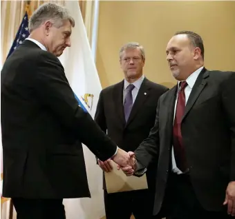  ?? NANCY LANE / HERALD STAFF PHOTOS ?? SAFETY ISSUE: Outgoing Secretary of Public Safety Daniel Bennett shakes hands with his successor, Thomas Turco as Gov. Charlie Baker looks on at the State House yesterday. Below, Turco speaks after being sworn in.