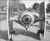  ?? THE CANADIAN PRESS/HO-ALLAN CARVER ?? A Nova Scotia man has hand-built the dream ride of “Star Wars” fans: A remote-controlled TIE fighter replica. Allan Carver of Queensland, N.S. welded together steel, foam and scrap wheelchair motors to create a twometre tall replica of the Imperial...