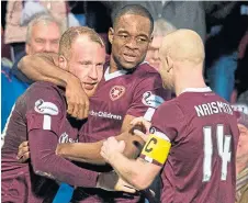  ??  ?? Liam Boyce (left) celebrates his winner for Hearts.