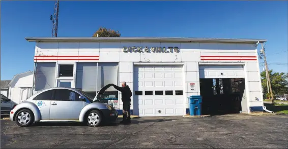  ?? (AP/The Kokomo Tribune/Kelly Lafferty Gerber) ?? Dick & Walt’s Foreign Car Repair is located in a former filling station in Kokomo, Ind. Dick Bougher, 83, has spent over 50 years in the business.