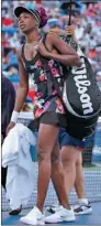  ?? MIKE SEGAR / REUTERS ?? Venus Williams walks off the court during a rain delay in her match against Zheng Jie at the US Open on Wednesday.