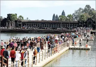  ?? HONG MENEA ?? Tourists visit the Angkor Wat temple last year. In 2022, Cambodia received nearly 2.277 million internatio­nal visitors – up 1,059 per cent from 196,495 in 2021.