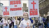  ?? OPA Images / Lightrocke­t via Getty Images ?? A protester expresses her opinion during an anti-vaccine rally in Hyde Park as the demonstrat­ion marches through central London.