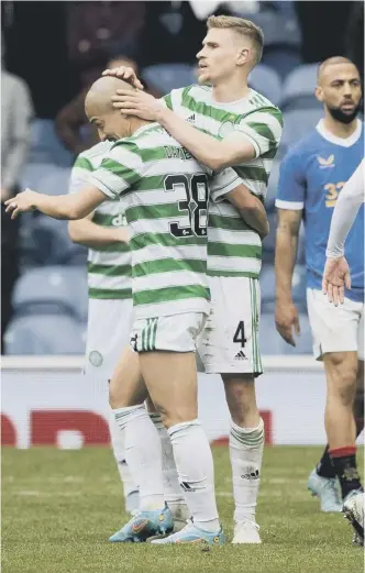  ?? ?? 2 Celtic captain Callum Mcgregor leaves Rangers midfielder Scott Arfield grounded as he drives forward at Ibrox. Above, Carl Starfelt celebrates at full-time with Daizen Maeda