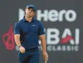  ?? KAMRAN JEBREILI/AP ?? Rory McIlroy reacts after missing a ball on the 18th during the second round of the Dubai Desert Classic on Saturday in Dubai, United Arab Emirates.