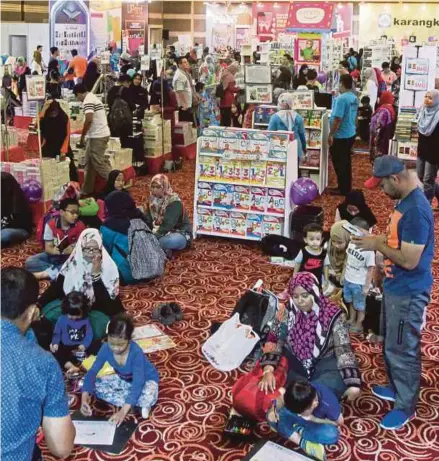  ?? FILE PIC ?? Visitors at the Kuala Lumpur Internatio­nal Book Fair last year. Reading can only happen if we create the time and space for it.