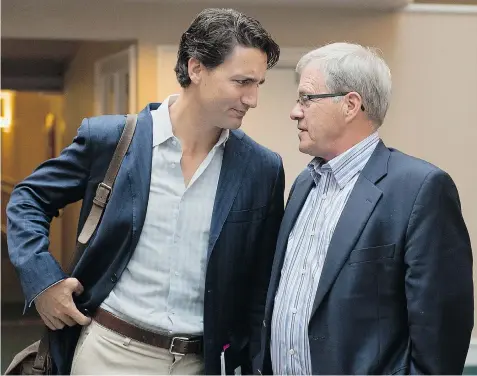  ?? ANDREW VAUGHAN/THE Canadian Press ?? Liberal leader Justin Trudeau, left, expects all his MPs, including longtime members like P.E.I.’s Lawrence MacAulay, right, to back the party’s pro-choice stance.