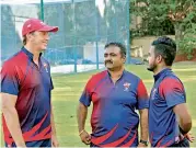  ??  ?? Glenn McGrath (left) interacts with MRF Pace Foundation trainee K.M Asif (right).
