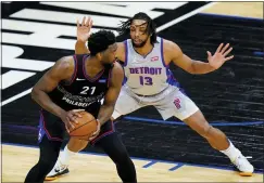  ?? MATT SLOCUM — THE ASSOCIATED PRESS ?? Joel Embiid ,left, tries to get around Detroit’s Jahlil Okafor on Saturday.