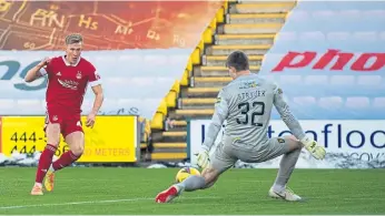  ??  ?? Goalkeeper Max Stryjek saves a Ross Mccrorie shot to keep Livi level