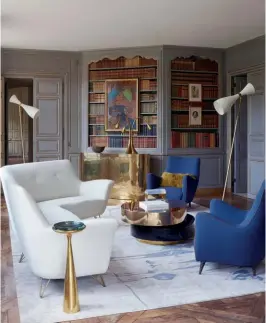  ??  ?? OPPOSITE PAGE A marble table by French artist Philippe Anthonioz was custommade for the dining room and is anchored next to a set of dining chairs designed by Italian architect Gio Ponti