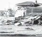  ??  ?? This photo shows some of the destructio­n done April 24, 1971, to a home in the Maplebrook subdivisio­n in Naperville, which had been hit by an F-2 tornado.