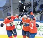  ?? NATHAN DENETTE/AP ?? Florida Panthers players celebrate after scoring against the New York Islanders during the Stanley Cup playoffs.