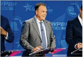  ?? RICHARD GRAULICH / THE PALM BEACH POST ?? When campaignin­g, Democratic gubernator­ial hopeful Jeff Greene, shown at an Aug. 2 debate, stresses his story as a self-made billionair­e. He waited tables at The Breakers and later did door-to-door sales before making it big in real estate.