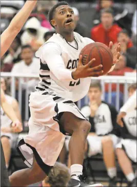  ?? Jeremy Stewart /
Rome News-Tribune ?? Coosa’s Xavier Bailey goes up for the shot that put the Eagles over Gordon Lee in the final seconds of Tuesday’s game during the first round of the Region 7-AA tournament.