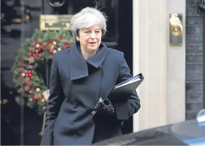  ?? Picture: PA. ?? Prime Minister Theresa May leaves 10 Downing Street having told Parliament there will definitely be no second vote on the whole Brexit deal.