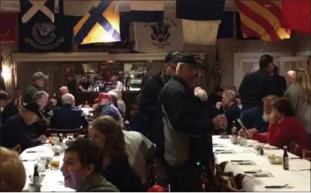  ?? ADAM DODD - NEWS HERALD ?? Veterans mingle before taking their seats for the Pearl Harbor Remembranc­e Dinner at Painesvill­e Township’s Hellriegel’s Inn.