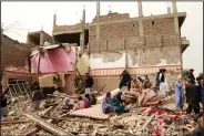  ?? Herat province. (AP/Hamed Sarfarazi) ?? People examine the site of Saturday’s car-bomb attack Afghanista­n’s