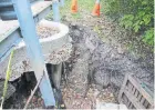  ?? JACK LAKEY ?? Water pouring into a storm drain on Humberview Road that is not connected to a drain pipe is washing out the area around it, including under the edge of the road.