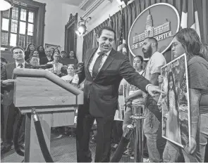  ?? AMERICAN-STATESMAN MIKALA COMPTON/AUSTIN ?? State Rep. Trey Martinez Fischer, D-san Antonio, points to a photo of Uvalde shooting victim Amerie Jo Garza during a May 8 news conference at the Texas Capitol as victims’ families call for gun law reform.