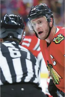  ?? CHRIS SWEDA /CHICAGO TRIBUNE ?? Blackhawks center Jonathan Toews talks with a referee during a game against the Blues on Nov. 16 at the United Center.