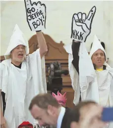  ?? AP PHOTO ?? IN THE CROWD: Demonstrat­ors protest during the Senate Judiciary Committee’s confirmati­on hearing for U.S. Sen. Jeff Sessions in Washington yesterday.