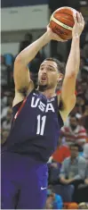  ?? CHARLIE NEIBERGALL/ASSOCIATED PRESS ?? Klay Thompson launches a fadeaway during Friday’s win. Thompson had 22 points.