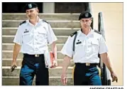  ?? ANDREW CRAFT/AP ?? Sgt. Bowe Bergdahl, right, and attorney Lt. Col. Franklin Rosenblatt leave after a preliminar­y hearing in May at Fort Bragg, N.C. Bergdahl had been set for trial in October.