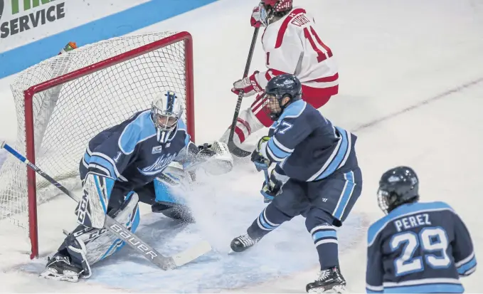  ?? NICOLAUS CZARNECKI / BOSTON HERALD ?? PROTECT AND SERVE: Maine goaltender Jeremy Swayman protects the net in the first period against Boston University last week at Agganis Arena. A fourth-round pick of the Bruins in 2017, Swayman already is building on his solid freshman season of a year ago with the Black Bears.