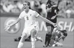  ?? Andy Clark AFP/Getty Images ?? ENGLAND midfielder Jill Scott reacts to her team’s victory, as Canada defender Allysha Chapman in background reacts to the loss.