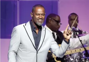  ?? Associated Press ?? ■ Brian McKnight performs at the Wal-Mart shareholde­r meeting in Fayettevil­le, Ark. McKnight's latest release,“Bedtime Story,” dropped last month.