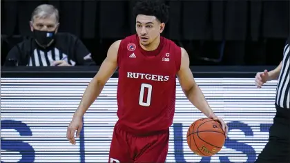  ?? MICHAEL CONROY — THE ASSOCIATED PRESS ?? Rutgers guard Geo Baker (0) plays against Illinois during a Big Ten Tournament quarterfin­al game last Friday in Indianapol­is.