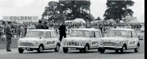  ??  ?? It’s race day in 1960 – a Saturday as it was until 1982 – and the drivers of these brand-new Mini Coopers in a support race are the same field of F1 drivers who would take part in the GP later that day. Bruce Mclaren, Graham Hill and Jim Clark cross the line almost together, with a partially hidden John Surtees just in their wake